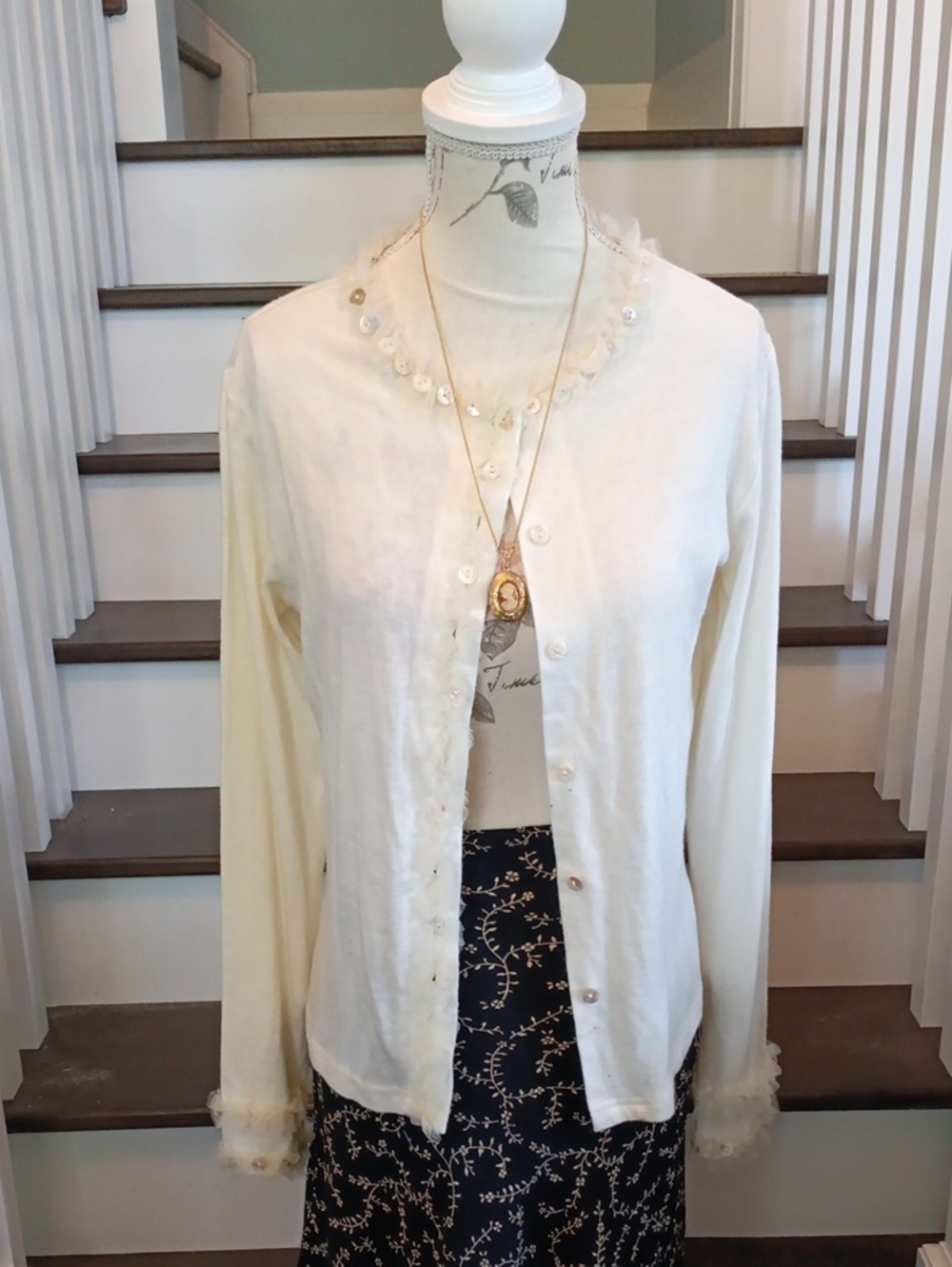 ^ Vintage Peltier Cream Cardigan with ruffle and button trim